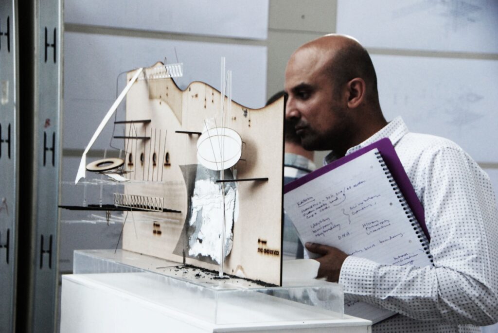 Sectional perspective - the model and the drawing on the wall read together. Peeping through parts of the model revealed information in the section on the wall