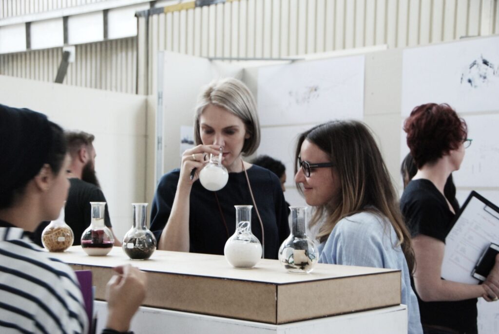 Panel of Professionals smelling jars to bring on a memory