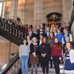 Group photo of iCARE project members in a grand stair case