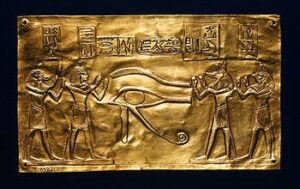Ancient Egyptian plate depicting the eye of Horus being worshipped by the gods