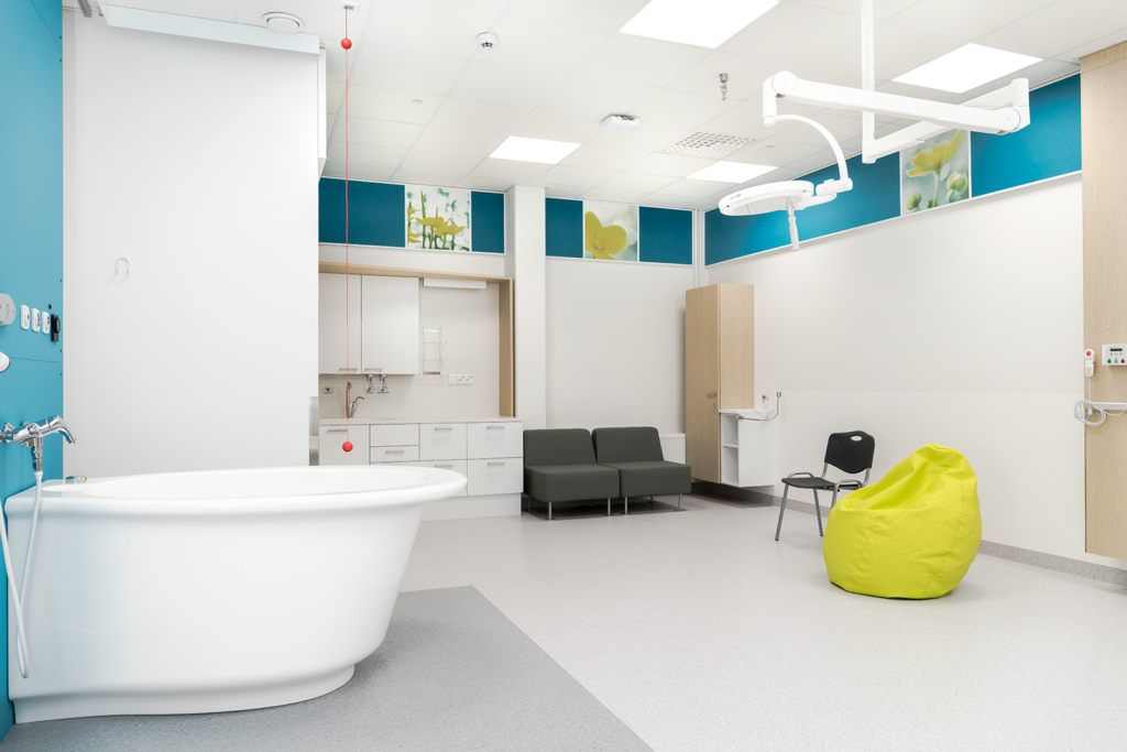 Good acoustics is easy to combine with good aesthetics. Delivery room at Tampere University Hospital with Ecophon Hygiene Performance ceiling and Ecophon Akusto Wall tiles with colors and prints. Photo Outi Aalto.