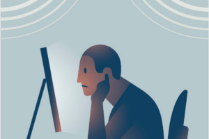 Illustration : Man at computer covering his ears