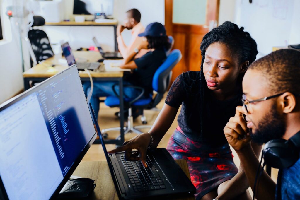 Colleagues collaborating at computer sccreen